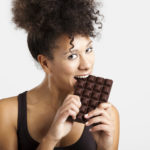 woman eats chocolate