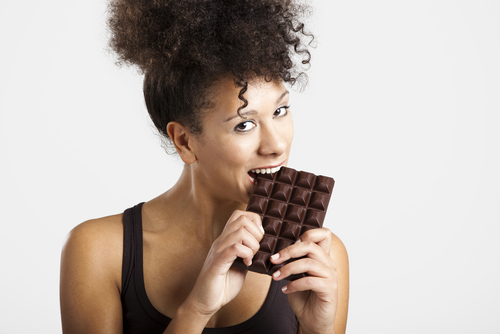 woman eats chocolate